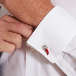 GEMELLI DA POLSO CON CORNETTO ROSSO In argento