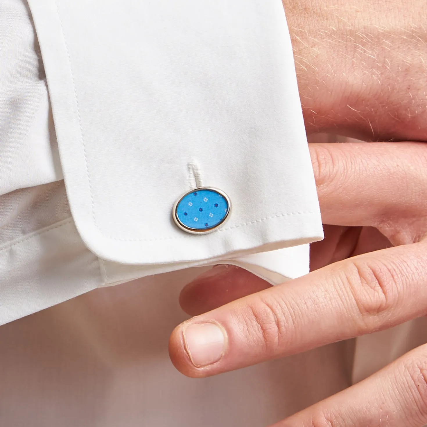 GEMELLI DA POLSO IN ARGENTO AZZURRO Con microfantasia fiore