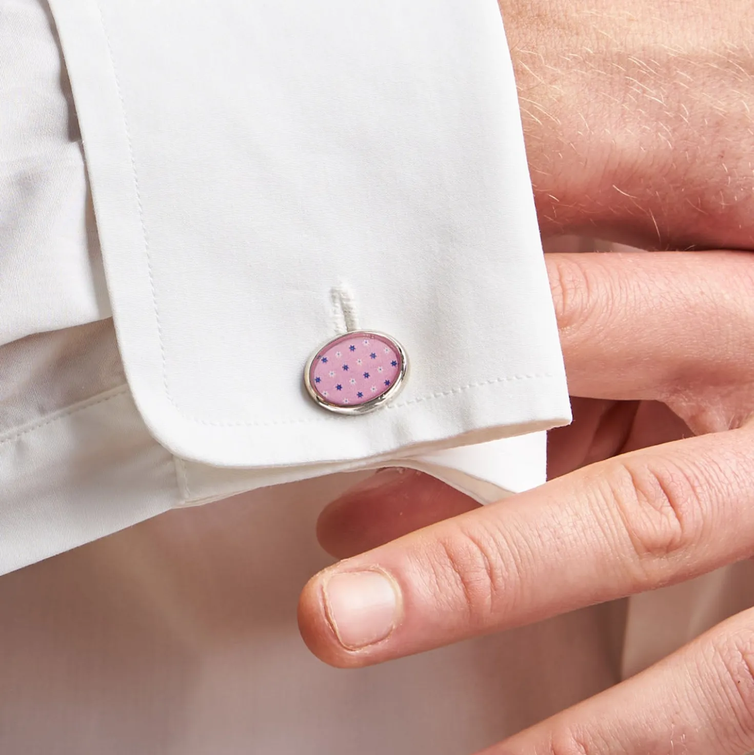 GEMELLI DA POLSO IN ARGENTO ROSACon microfantasia fiore